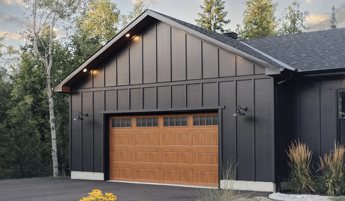 Clopay Gallery Steel carriage-house style garage door in a wood-grain finish
