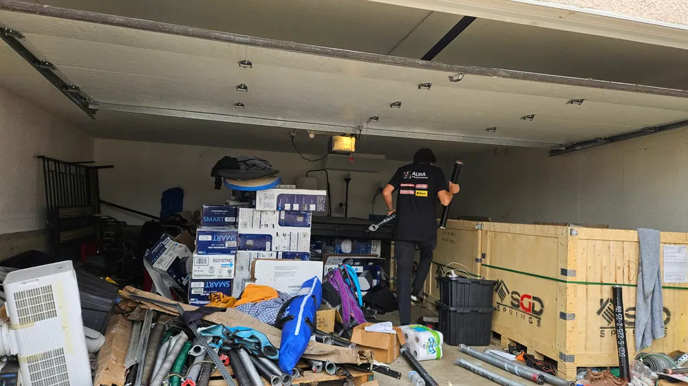 Technician working at the back of a garage
